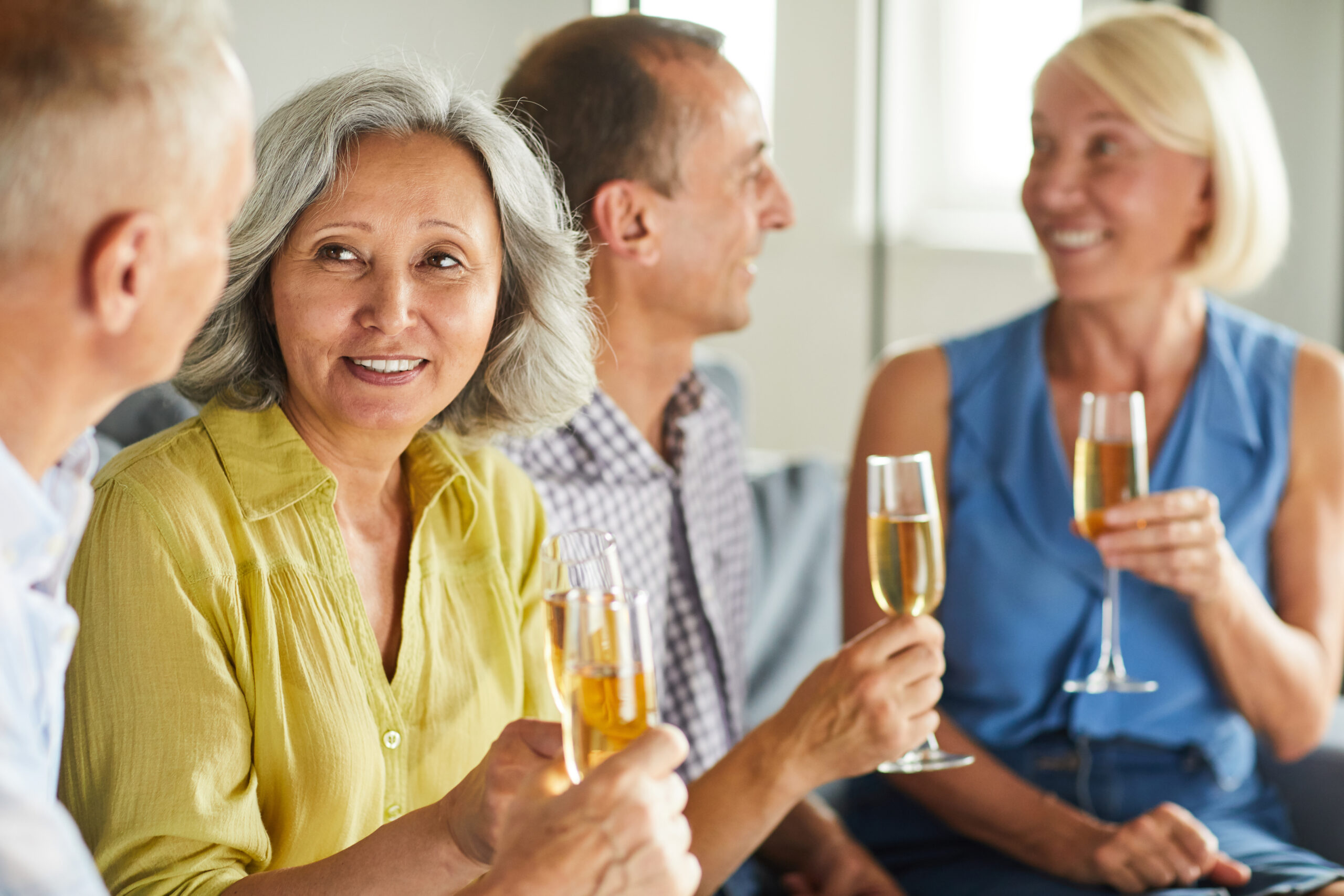 Adult People Drinking Champagne at Party